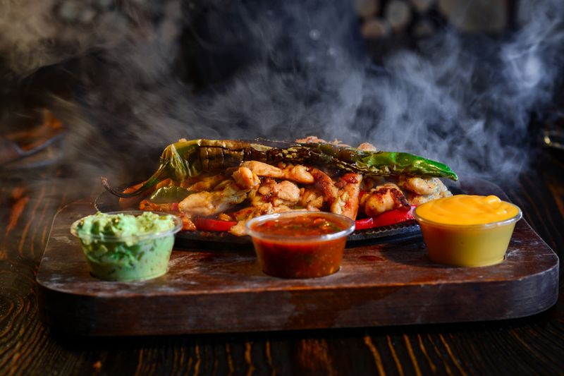 Classic dions pizza with fresh toppings on wooden board